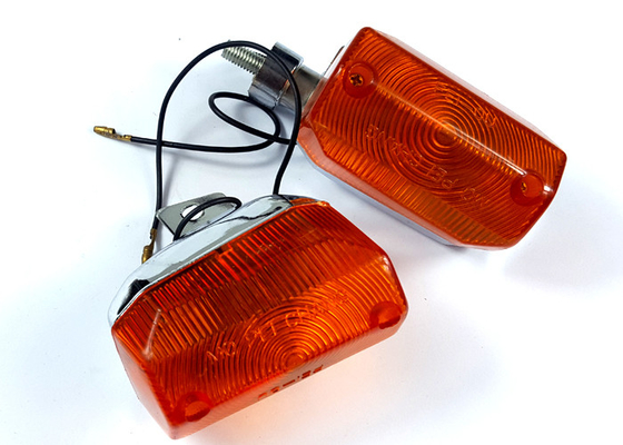 A lâmpada plástica de Winker da motocicleta/gerencie a caixa branca clara da tampa alaranjada de V50 F e de R